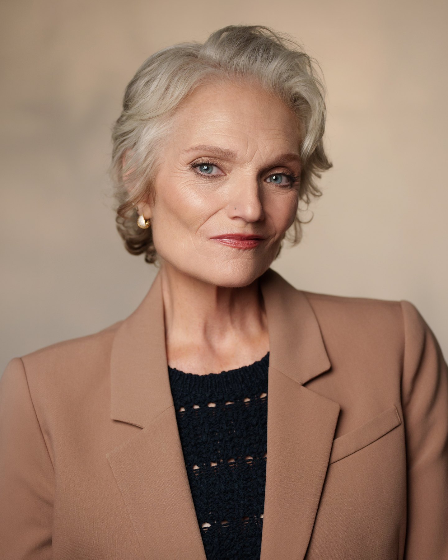 Catherine Handy, New York, commercial headshot in a camel blazer, photographer Kat Hennessey